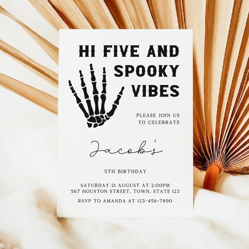 May include: Black and white invitation with a skeleton hand graphic. The text reads "Hi Five and Spooky Vibes" and "Jacob's 5th Birthday". The invitation includes the date, time, and address for the party.