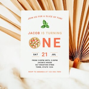 May include: A white invitation card with a red and orange pizza illustration and the text "JOIN US FOR A SLICE OF FUN! JACOB IS TURNING ONE SAT 21 JUL FROM 2:00PM UNTIL 5:00PM JACOB'S HOUSE 567 HOUSTON STREE TOWN, STATE 1234 RSVP TO AMANDA AT 123-456-7890"