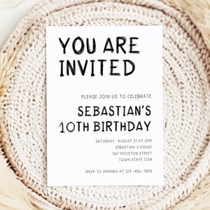 May include: A white invitation card with black text that reads "You are invited" and "Please join us to celebrate Sebastian's 10th Birthday". The invitation includes the date, time, and location of the party.