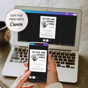 May include: A digital design for a Halloween party invitation with a black skeleton hand graphic and the text "Hi Five and Spooky Vibes" in white. The invitation is being edited on a laptop and a smartphone.