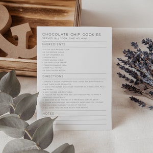 May include: A printable recipe card for chocolate chip cookies. The recipe card is printed on white paper with gray text. The recipe includes ingredients such as self-raising flour, brown sugar, vegetable oil, eggs, golden syrup, vanilla ice cream, baking soda, milk, and salted butter. The recipe also includes directions for making the cookies.