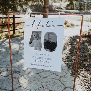 May include: A white sign with black text that reads "look who's 40". The number 40 is made up of two photos, one of a young boy and one of an adult man. The sign also says "Welcome to David's 40th Birthday, Saturday 24th August 2024".