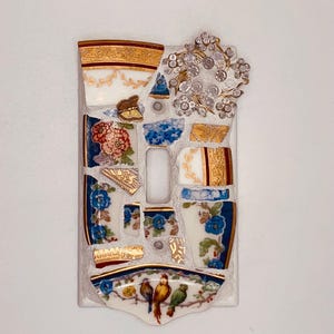 May include: A rustic wooden sign with the text "Welcome to our home" in white lettering. The sign features a distressed finish and a simple, inviting design, perfect for entryway decor.