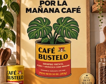 May include: A framed poster featuring a yellow and red Café Bustelo coffee can with a green monstera plant growing out of it. The text reads POR LA MAÑANA CAFÉ, CAFÉ BUSTELO, SIEMPRE FRESCO, PURO Y AROMÁTICO COMO NINGUNO, and PESO NETO 10 OZ. (283g).
