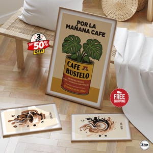 May include: Three framed wall art prints featuring coffee-themed illustrations. The largest print displays a Cafe Bustelo coffee can with a monstera plant, while the two smaller horizontal prints show abstract coffee splashes and latte art designs.