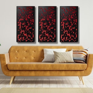 May include: Three black metal wall panels with a red geometric pattern. The panels are arranged in a row on a white wall above a brown leather couch.