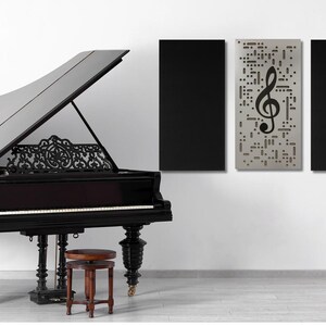 May include: A black grand piano with an open lid, ornate legs, and a small stool. Three wall panels are visible: two black and one with a treble clef design. A decorative music stand is also present.