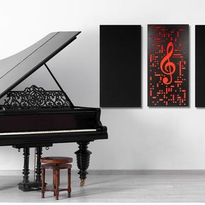 May include: A black grand piano with the lid open, a wooden stool, and three black framed wall panels. The center panel features a red treble clef graphic.