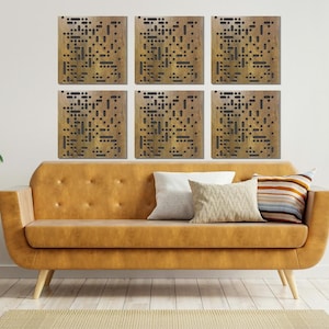 May include: Six square-shaped wall panels with a geometric pattern of small holes. The panels are a light brown color and are arranged in a grid pattern on a white wall. A brown couch with pillows sits in front of the wall panels.