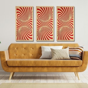 May include: Three abstract wall art panels with a swirling red and white pattern. The panels are hanging on a white wall above a brown couch.