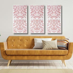 May include: Three rectangular wall art pieces with a white background and a red pixelated pattern. The art pieces are hanging on a white wall above a brown leather couch.