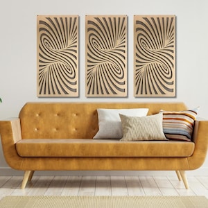 May include: Three abstract wall art panels with a swirling black and white pattern. The panels are hanging on a white wall above a brown couch.