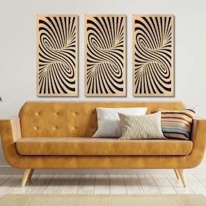 May include: Three black and white abstract wall art panels with a swirling pattern. The panels are hanging on a white wall above a brown couch.