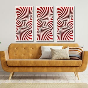 May include: Three abstract art prints with a red and white swirling pattern. The prints are hung on a white wall above a brown couch.