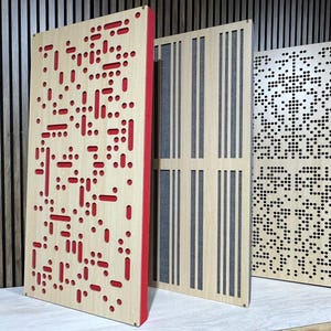 May include: Three acoustic panels with different patterns. The panel on the left has a red border and a pattern of red circles and lines. The middle panel has a pattern of vertical lines. The panel on the right has a pattern of small black circles.