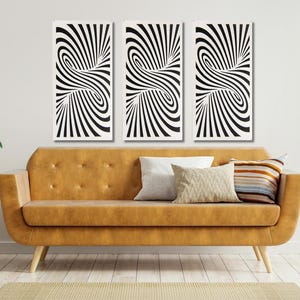 May include: Three framed black and white abstract art pieces with a swirling design hang above a mustard-colored sofa. The room is decorated with plants and pillows, creating a modern and stylish living space.