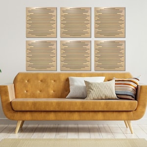 May include: Six square acoustic panels with a wood grain finish and a geometric pattern of horizontal lines. The panels are arranged in a grid pattern on a white wall behind a brown couch with pillows.