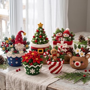 May include: A collection of six crocheted Christmas decorations including a gnome with a penguin, a tree, two snowmen in a gift box, a poinsettia, a gingerbread person with a candy cane, and a reindeer, all featuring festive colors.