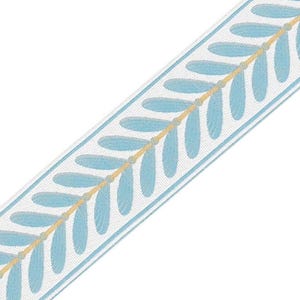 May include: A white ribbon with a blue and gold leaf pattern. The ribbon is woven with a repeating pattern of blue leaves and gold stems.