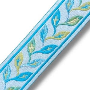 May include: Light blue ribbon trim with a repeating pattern of turquoise and gold leaves.