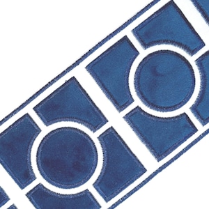 May include: A decorative trim featuring a repeating geometric pattern. The design includes navy blue shapes, including circles and diamond-like forms, outlined in white. The trim has a textured appearance and is set against a white background.