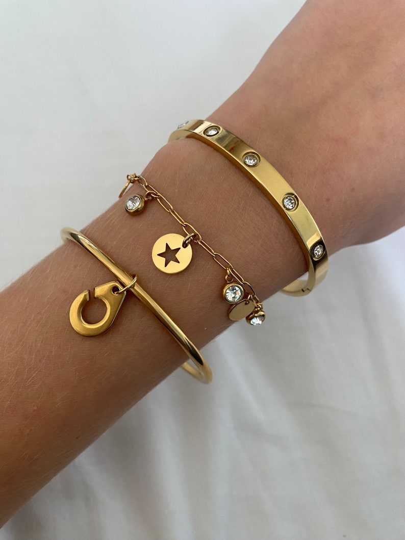 golden stainless steel bangle with charm menotte