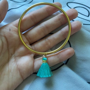 golden stainless steel bangle with charm pompon bleu