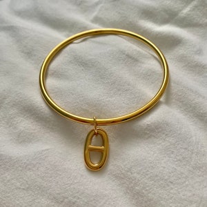 golden stainless steel bangle with charm image 6