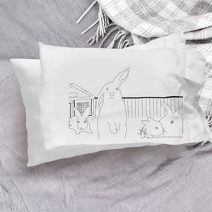 Pillowcase with four rabbits in farm