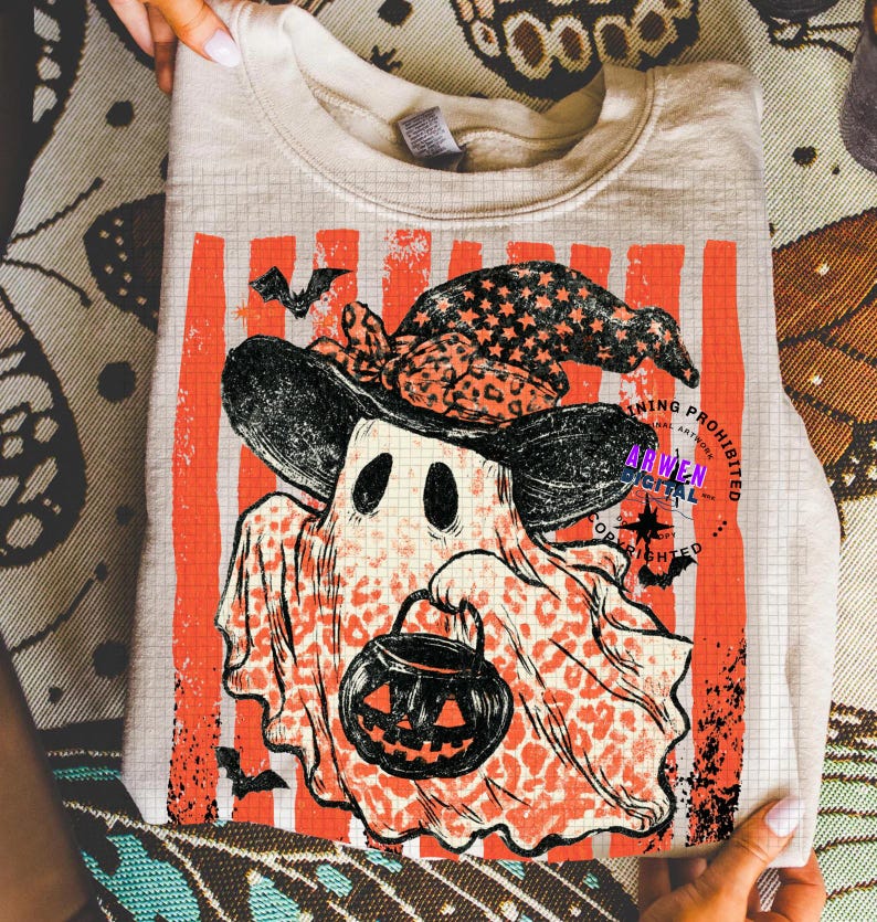 May include: A beige crewneck sweatshirt featuring a graphic of a ghost wearing a leopard print witch hat and holding a jack-o'-lantern bucket. The design includes vertical orange stripes, small bats, and the text Arwen Digital Copyrighting Prohibited.