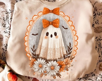 Fantasma fofo em PNG, design de sublimação para o Halloween com laços e flores, clipart feminino para a temporada assustadora, download digital para camisetas.