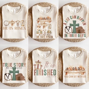 Puede incluir: Seis dise&ntilde;os diferentes para camisetas con temas cristianos. Los dise&ntilde;os presentan cruces, l&aacute;pidas y textos como "Ha resucitado", "Historia real", "Est&aacute; terminado" y "Puedes sentarte con nosotros".