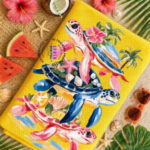 May include: Yellow beach towel featuring a vibrant illustration of sea turtles, starfish, and tropical flowers. The design incorporates shades of blue, pink, and orange. The towel is surrounded by watermelon slices, seashells, and sunglasses.