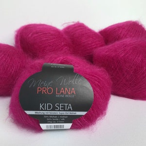 May include: Pink balls of yarn labelled "Meine Wolle Pro Lana Kid Seta" with the text "Mischung mit feinstem Super-Kid Mohair 70% Mohair/mohair 30% Seide/silk 25g ca. 210m".