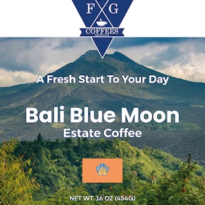 May include: A coffee bag featuring a scenic mountain landscape with the text "Bali Blue Moon Estate Coffee." The bag includes the text "A Fresh Start To Your Day" and "NET WT. 16 OZ (454G)." The coffee is made with 100% Arabica coffee beans.