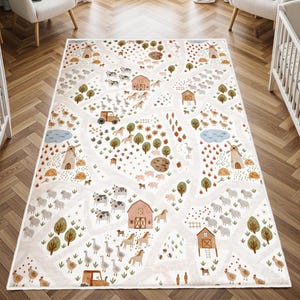 May include: A cream-colored children's play rug with a farm scene design. The rug features illustrations of barns, animals, trees, and roads. The design includes cows, sheep, horses, chickens, and a tractor. The rug is rectangular.