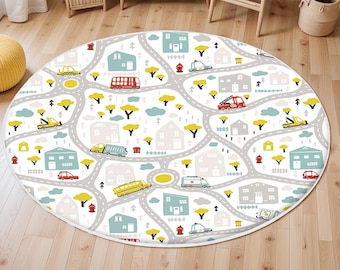 May include: A round, white playmat with a city street design. The playmat features a variety of vehicles, including cars, trucks, buses, and an ambulance. The streets are gray and the buildings are white with red roofs. The playmat is perfect for imaginative play.
