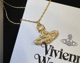 Vivienne Westwood Collier doré à pendentif boule de cristal et étoiles Astrid avec boîte