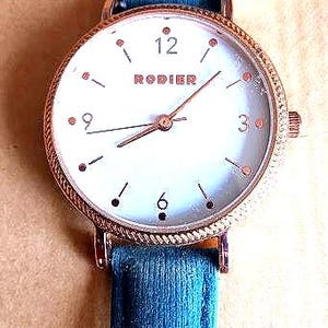 Luxury women&#39;s watch CHRISTIAN LACROIX with quartz battery, gold-colored steel, rhinestones, blue leather strap, made in France, collection, gift