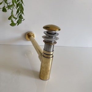 Push Up Button - Pop Up Drain - Brass Water Trap - Solid Unlacquered Brass P-trap and Sink Stopper .