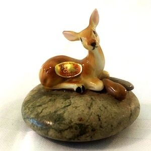 Small Ceramic Figurine of a Deer Lying on a Stone .made in Japan.