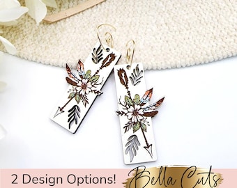 May include: Two pairs of wooden earrings with a white background. Each earring features a floral design with arrows and feathers. The earrings are designed to be laser cut and are available in two different designs.