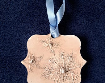 Love in a mist, painted Plaster Hanging Tile: Bas Relief