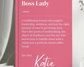 May include: Pink printable card with the text "Boss Lady" defined as a "trailblazing woman who juggles leadership, ambition, and just the right amount of sass to get things done. She's the queen of multitasking, the slayer of deadlines, and the one who knows how to handle chaos with a smirk and a perfectly timed coffee break." The card also includes the text "See Also: Katie".