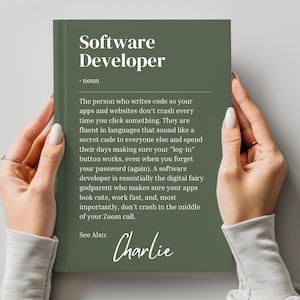 May include: A green book with the title "Software Developer" and a definition of the term. The book also includes the text "See Also: Charlie".