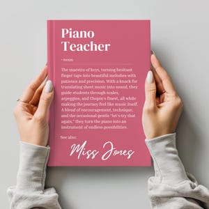 May include: A pink card with the text "Piano Teacher" and a definition of the word. The card also includes the text "See also: Miss Jones".
