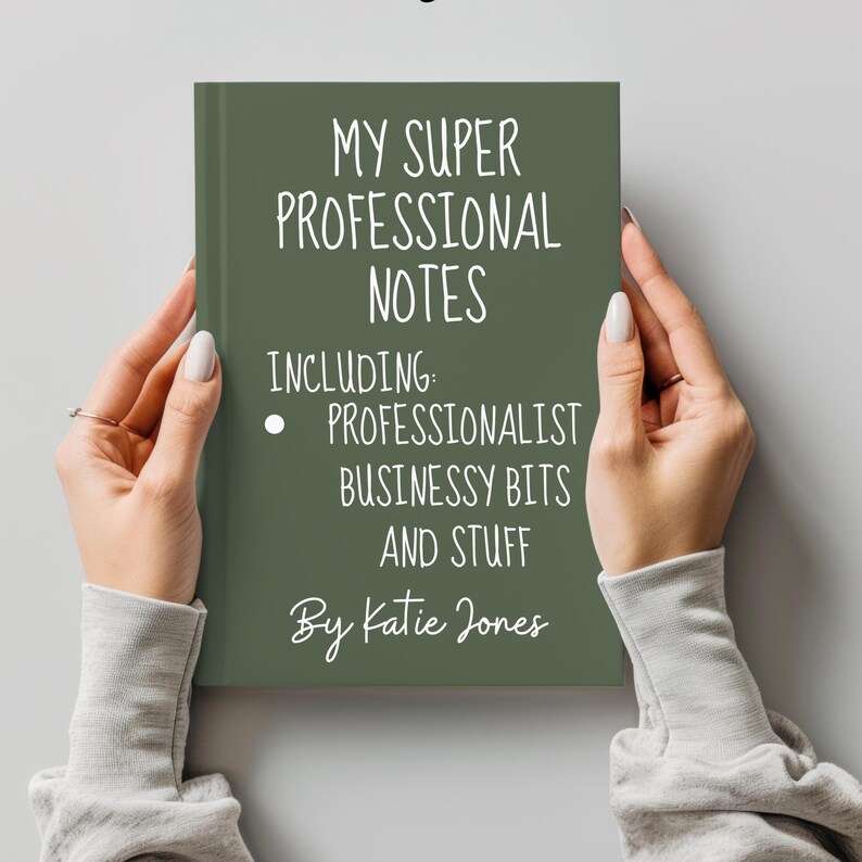May include: A green notebook with the text "MY SUPER PROFESSIONAL NOTES INCLUDING: PROFESSIONALIST BUSINESSY BITS AND STUFF By Katie Jones" in white lettering.