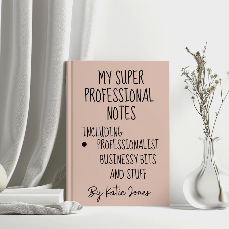 May include: A pink notebook with the title "My Super Professional Notes" and the text "Including: Professionalist Businessy Bits and Stuff" and "By Katie Jones".