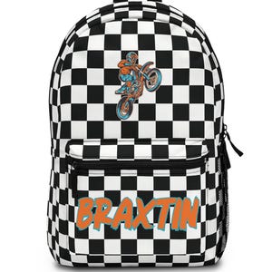 May include: A backpack featuring a black and white checkered pattern. The front displays a graphic of a person riding a dirt bike on the back wheel. Below the graphic, the name BRAXTIN is printed in large, orange, stylized capital letters.