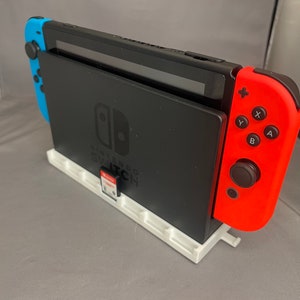 Uchwyt ścienny do konsoli Nintendo Switch i kartridży z grami - mieści 7 kartridży, biały